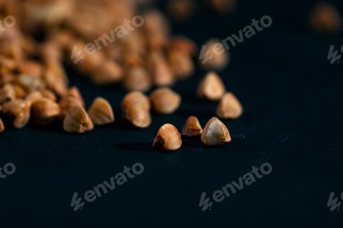 Preview: close up buckwheat lies on a black and blue background Ukrainian culture light protein food