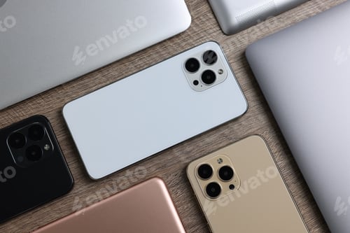 Preview: Many different modern gadgets on wooden table, flat lay