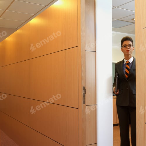 Preview: Businesswoman coming out of her office