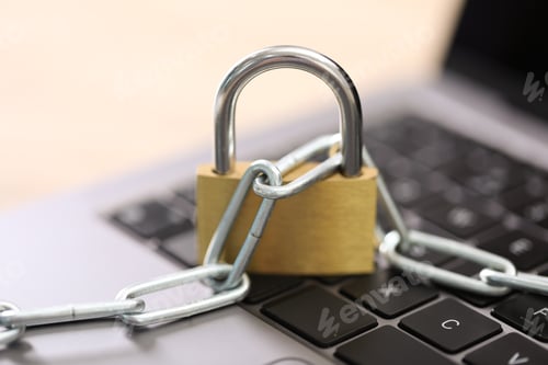 Preview: Cyber safety. Metal padlock with chain on laptop, closeup