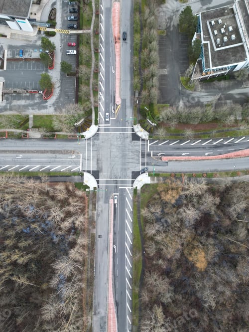 Preview: aerial view of an intersection with multiple lanes and different buildings