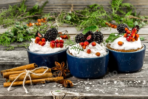 Preview: beautiful Christmas cupcake with cream and berry