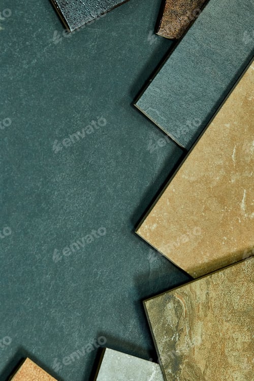Preview: Frame of various different decorative tiles samples on stone background.