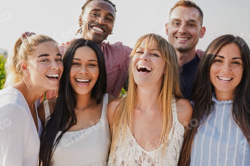 Preview: Group of multiracial people smiling on camera during summer time outdoor