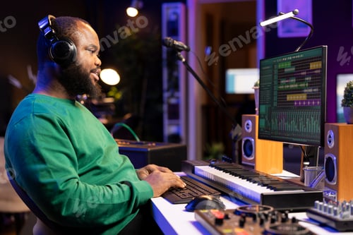 Preview: Man Working on Computer in Recording Studio