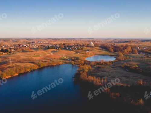 Preview: Aerial shot of a city with lakes during autumn in the USA