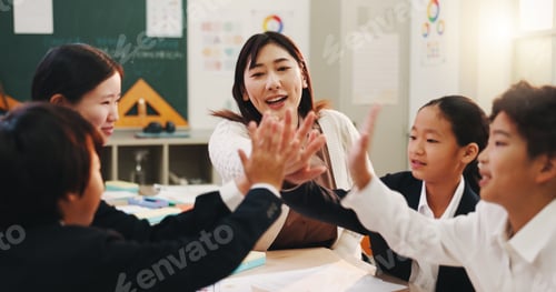 Preview: Teacher, children and high five in classroom for language development, group project and growth. Ja