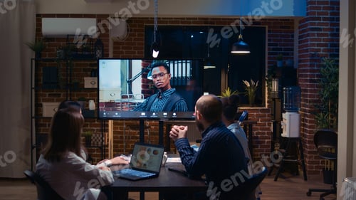 Preview: Employees talking with team leader in remote business meeting