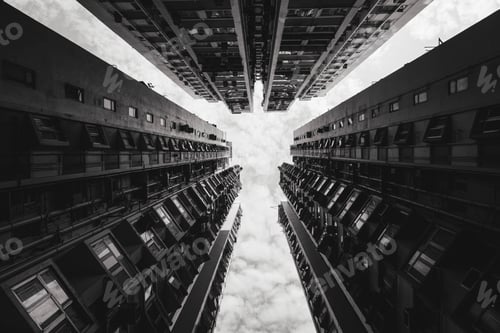 Preview: Low-angle shot of tall skyscrapers in greyscale - great for backgrounds