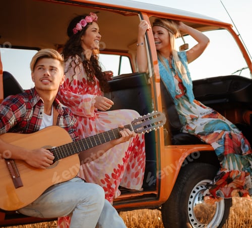 Preview: Hippie friends with guitar on a road trip