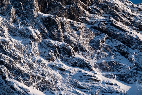 Preview: Rocks with snow as a background. Texture effect for design. Natural material