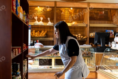 Preview: Woman working in a bakery bread shop