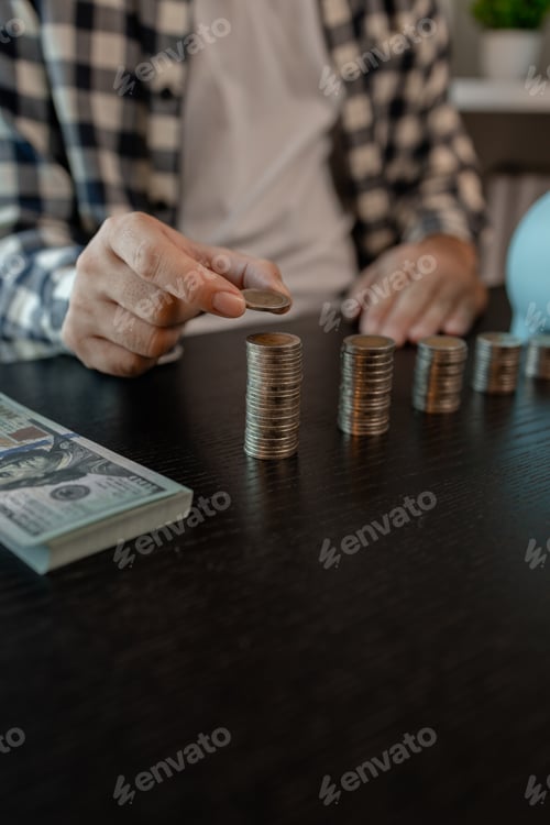 Preview: he is saving money for his future plans, putting some if his income in a piggy bank