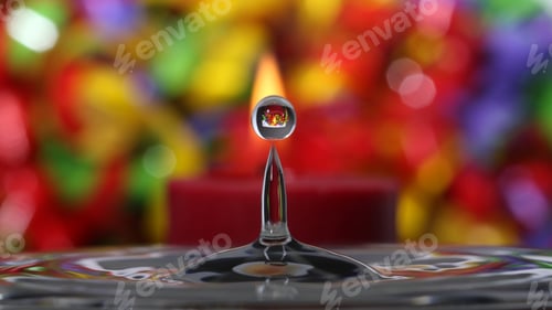 Preview: Water Splash Droplet With Candle And Colored Background - Photograph Of A Water Droplet In Front Of