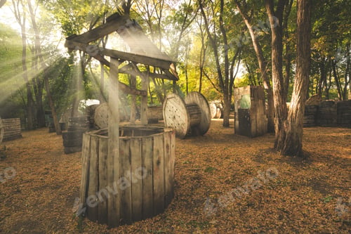 Preview: The old broken well was used as a fence at the paintball base