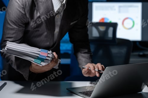 Preview: An entrepreneur sits alone in his company's private office, Notes are recorded on the computer becau