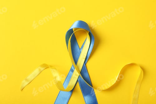 Preview: Support Ukraine concept, blue and yellow awareness ribbons on yellow background