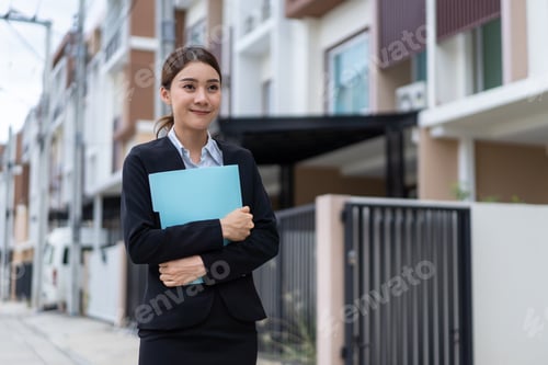 Preview: Portrait of Asian young businesswoman stand outdoor and crossing arm.