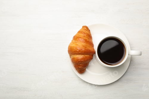 Preview: Plate with cup of coffee and croissant on white wooden background, flat lay. Space for text