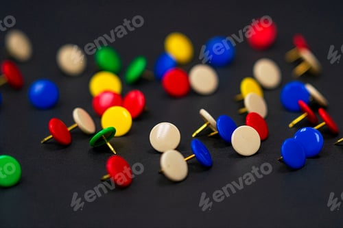 Preview: Multi-Colored Thumbtacks on Dark Background