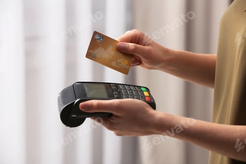 Preview: Woman using modern payment terminal indoors, closeup