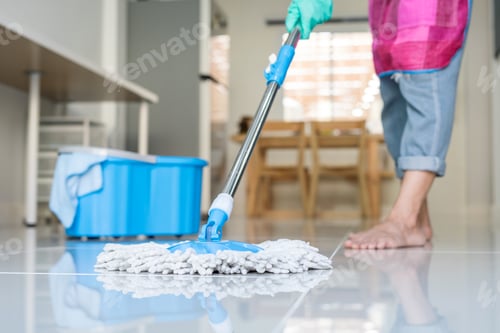Preview: Young woman cleaning floor with mop and bucket