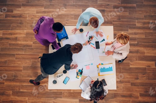 Preview: High angle of a multiracial business people having a meeting in an office