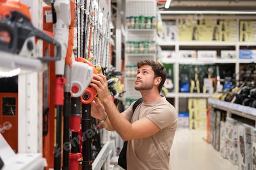 Preview: Guy shopping in store of power tools