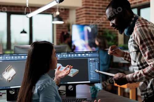 Preview: Production department employees developing advanced graphics technology using specialized software.