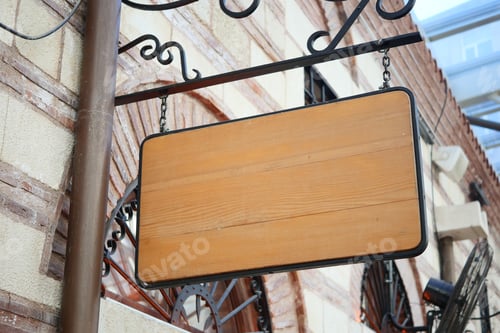 Preview: Street signboard mockup on modern city building