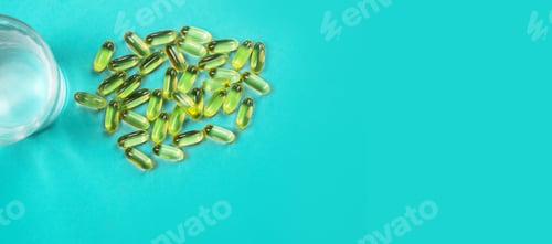 Preview: Omega 3 fish oil capsules spilling out of a bottle on a blue background.