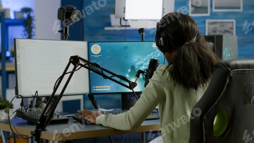 Preview: Black player wearing headphones talking with other players chatting