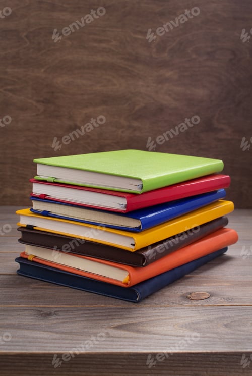 Preview: notepad or paper notebook at wooden table