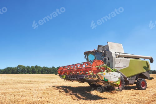 Preview: combine harvester working on a wheat field