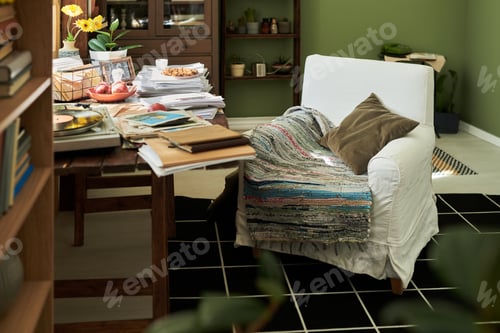 Preview: Cozy Living Space with White Armchair and Books