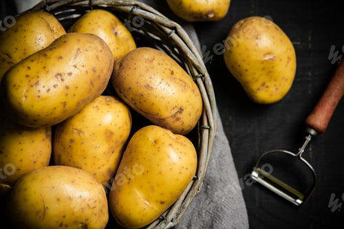 Preview: Fresh potatoes. On black background.