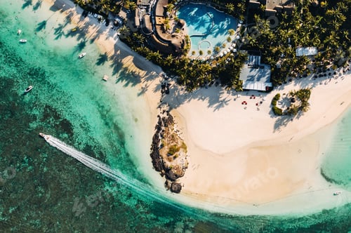 Preview: Aerial picture of the east coast of Mauritius Island. Flying above the turquoise lagoon of Mauritius