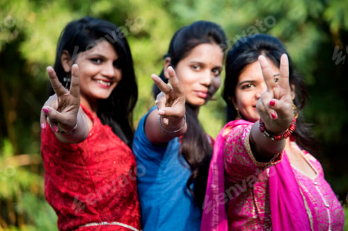 Preview: Happy Indian young girls smiling and having fun at outdoor.