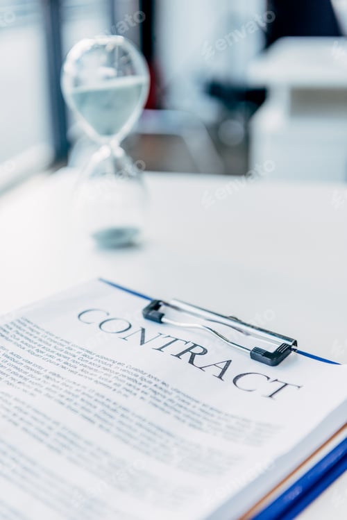 Preview: close-up shot of clipboard with contract on white desk at office