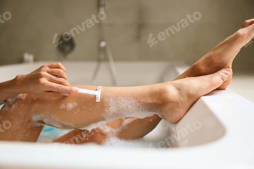 Preview: A young woman is happily bathing in a bathtub
