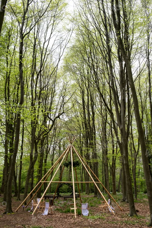 Preview: Wooden structure with wreath for a woodland naming ceremony.