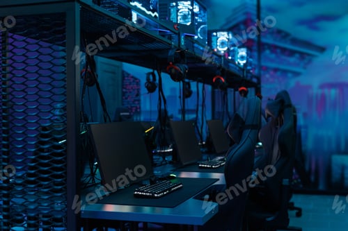 Preview: Professional gaming table with gaming PC, headset, keyboard, mouse and monitor with neon light.