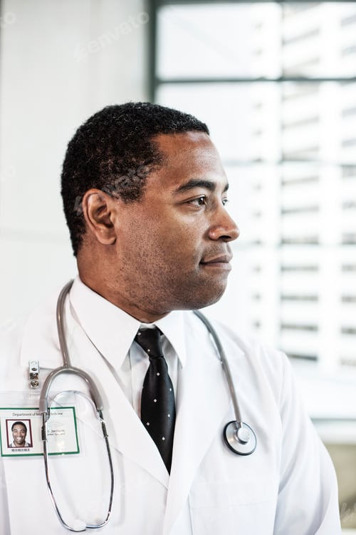 Preview: Black man doctor in lab coat with a stethescope.