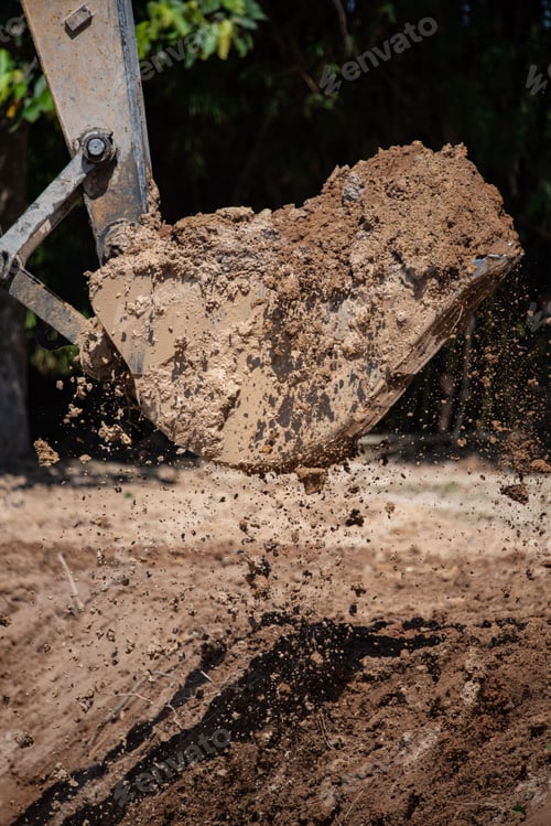 Preview: bulldozer machine digging the ground and removing sand for excavation purpose