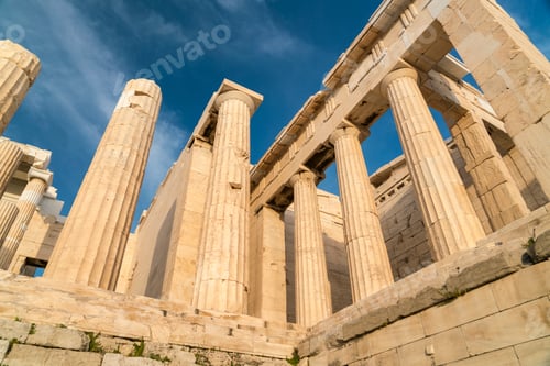Preview: Ancient columns reach towards a clear blue sky at a historic site