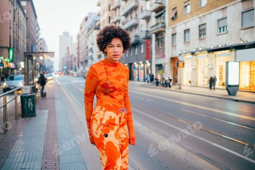 Preview: Young afro curly hair woman posing outdoor carefree cool attitude