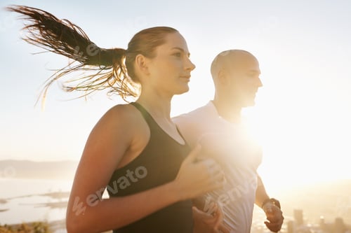 Preview: Their favourite way to start the day. Shot of a young couple exercising outdoors.