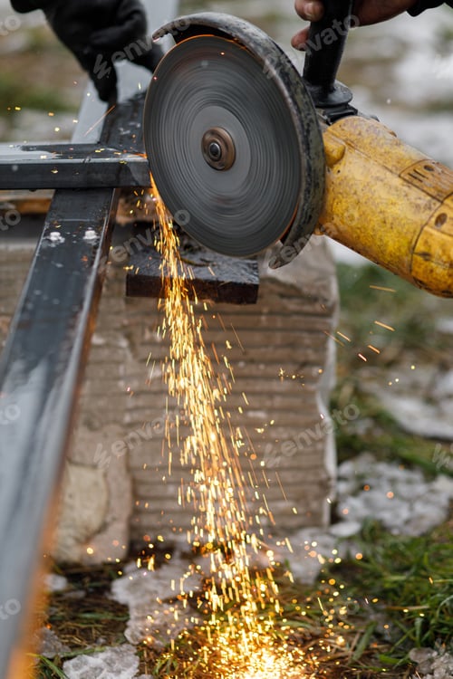 Preview: Close up of man grinding metal with circular grinder disc and electric sparks