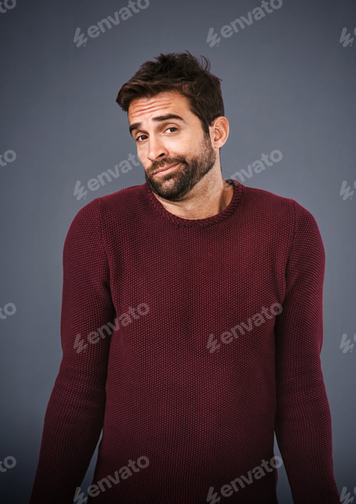 Man Wearing Red Sweater Looking at the Camera
