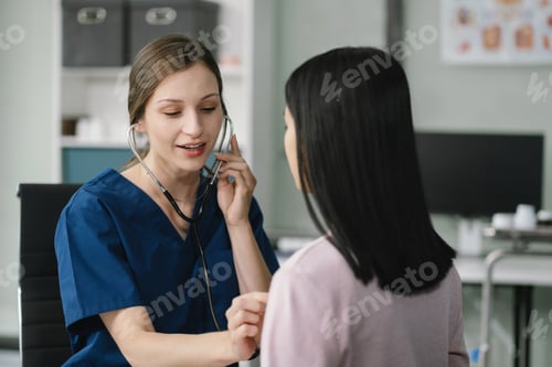 Preview: Doctor with stethoscope examining patient with examination